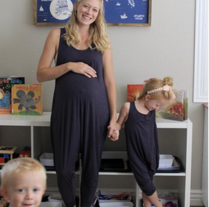Mom and daughter wearing matching romper jumpsuits in blue.