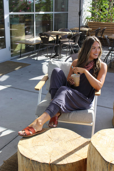 Relax while out at your favorite coffee spot in a Slate Blue Momper Romper.