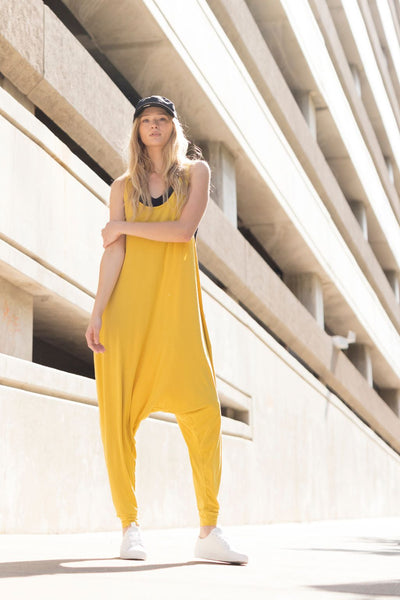 Momper Romper jumpsuit for women in mustard yellow.